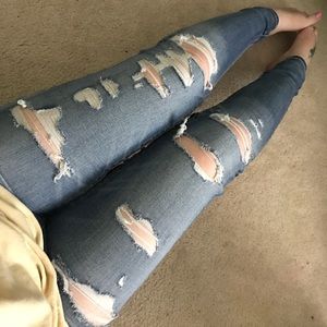 AE distressed jeans with holes.