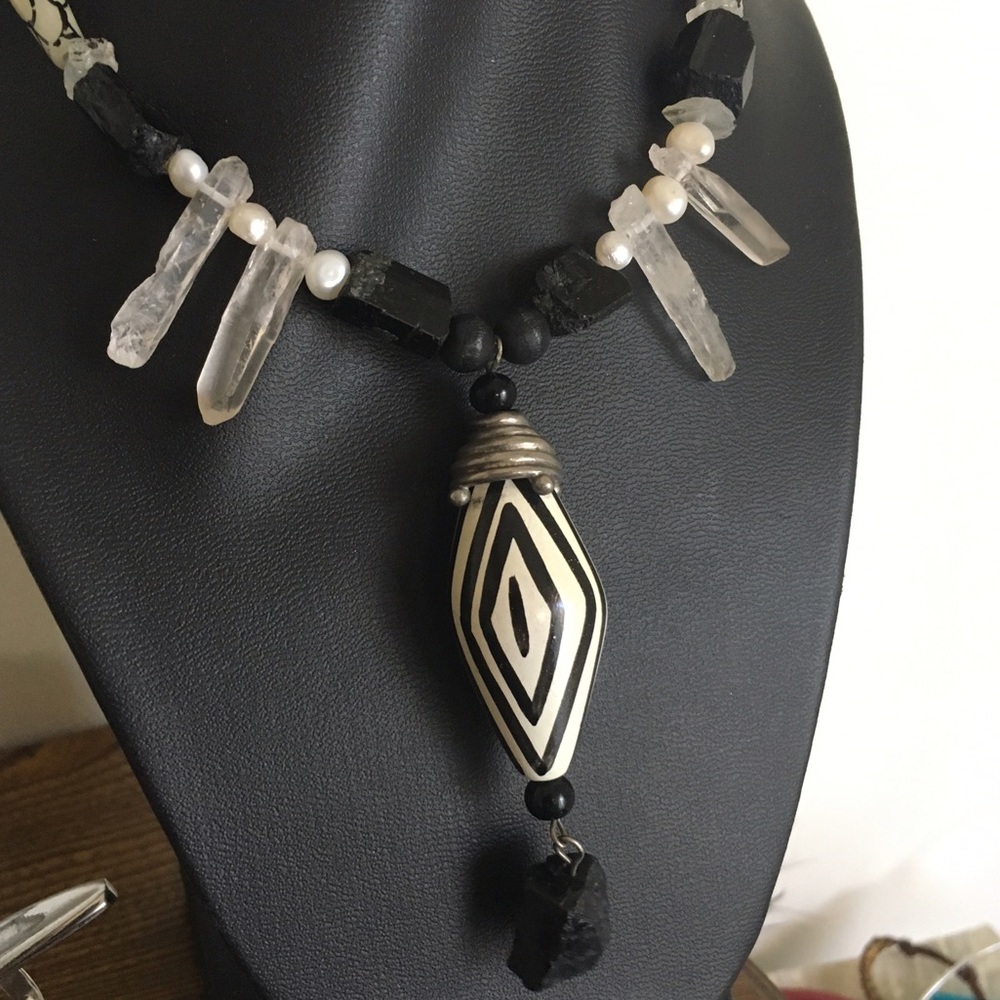 Long black and white necklace w/statement center