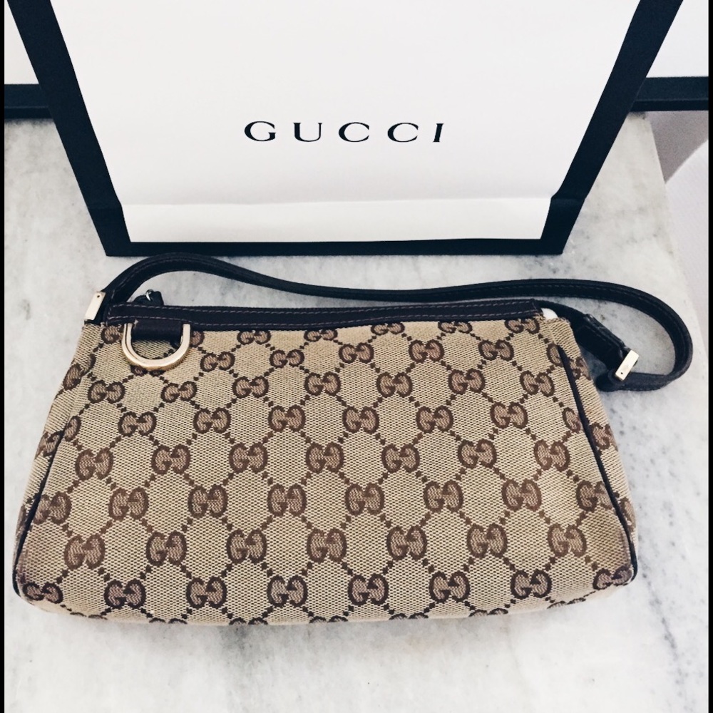 Gucci Small purse in classic monogram canvas