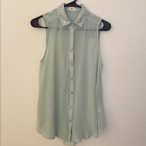 Sheer, sleeveless mint top.
