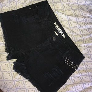 Mid rise black studded distressed shorts