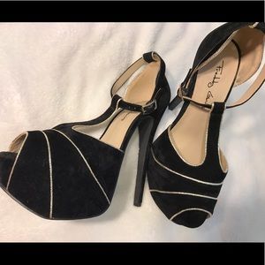 Black with gold T strap heels