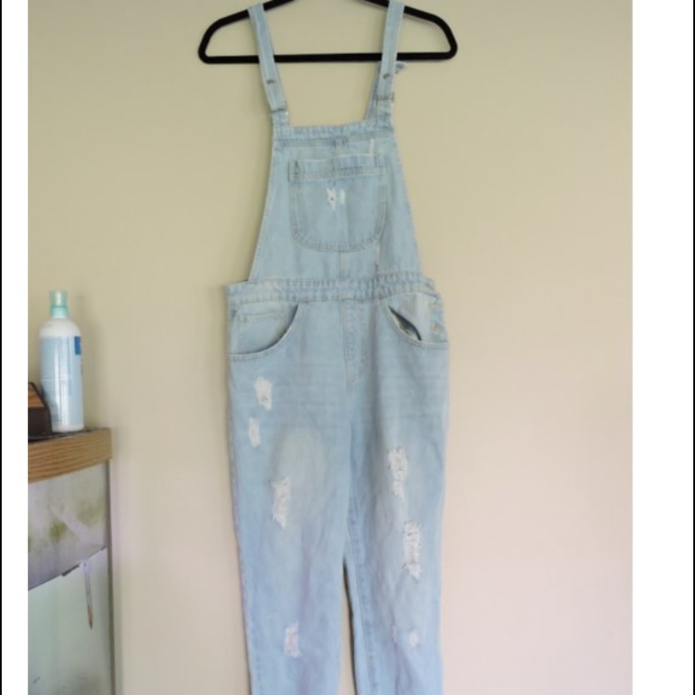 Distressed denim overalls