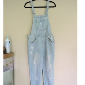 Distressed denim overalls