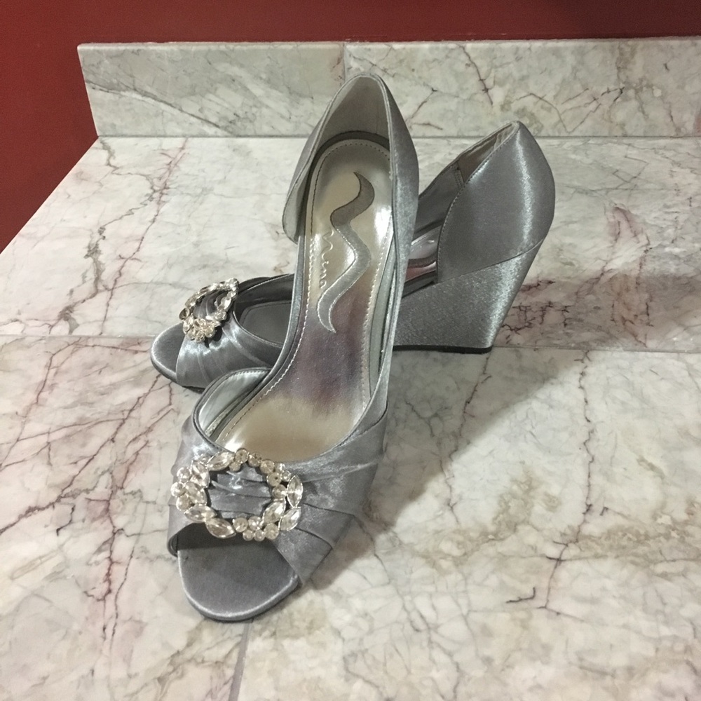 Silver satin wedges. Rhinestone buckle detail!