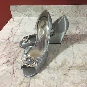 Silver satin wedges. Rhinestone buckle detail!