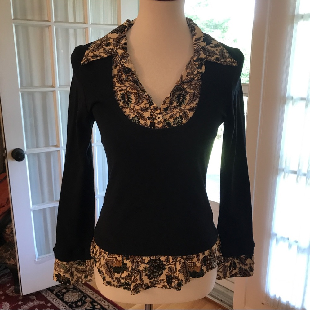 Black shirt with mock blouse under. Fitted.