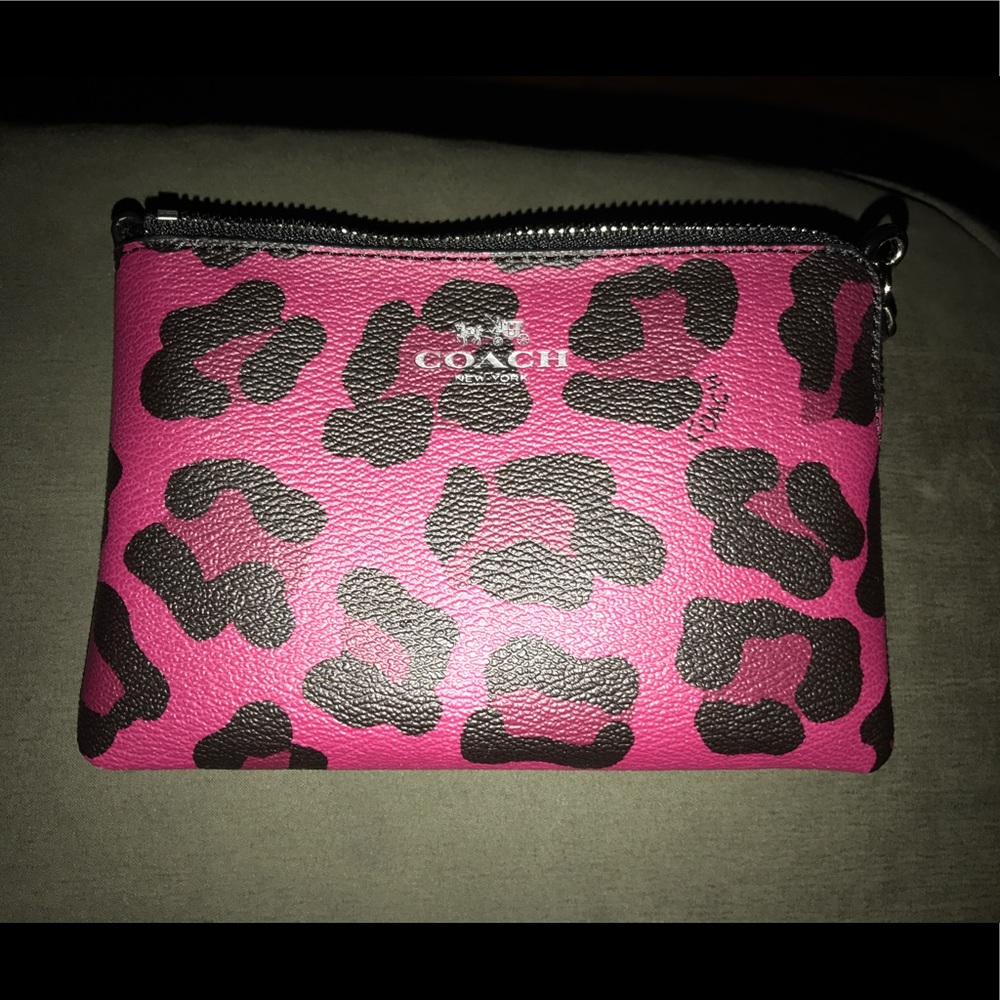 Cranberry color cheetah Coach Wristlet