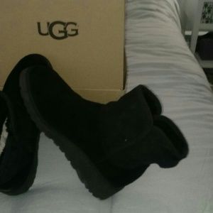 A pair of UGG ankle boots with a wedge
