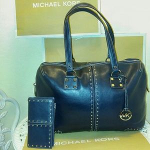 Mini duffle bag and wallet matching set.