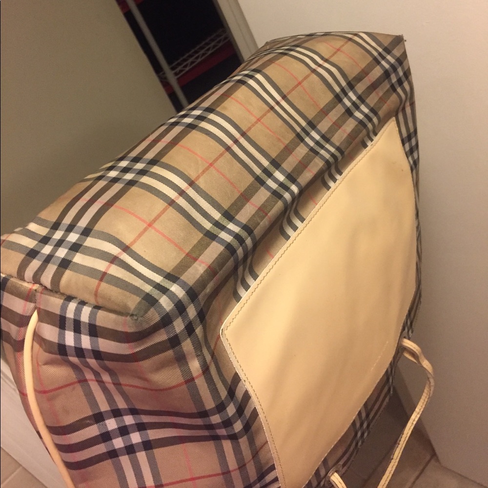 Additional pics of bag, tear and wear at bottom.