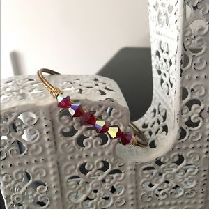 Gold bracelet with Red gems