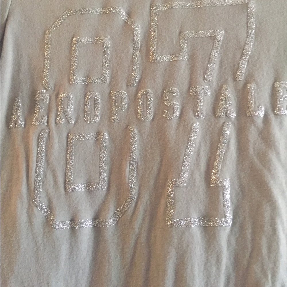 A gray glitter 87 Aeropostale shirt.