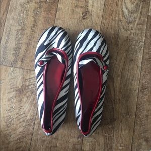 A red and zebra pair of flats