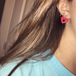 2 pairs of heart earrings, one pink one yellow