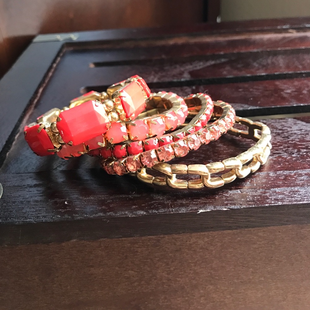 Coral and gold stackable bracelets.
