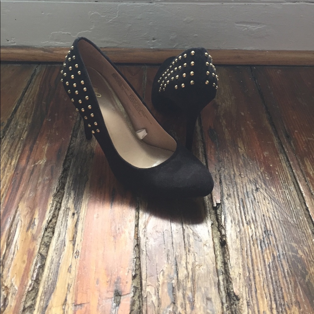 Black sued heels with gold studded backs.