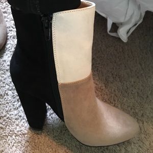 Beige, black and white boot heels