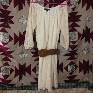 Off white dress with brown belt.