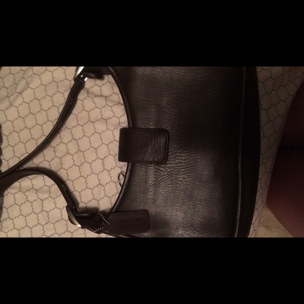 Brown leather Coach purse.