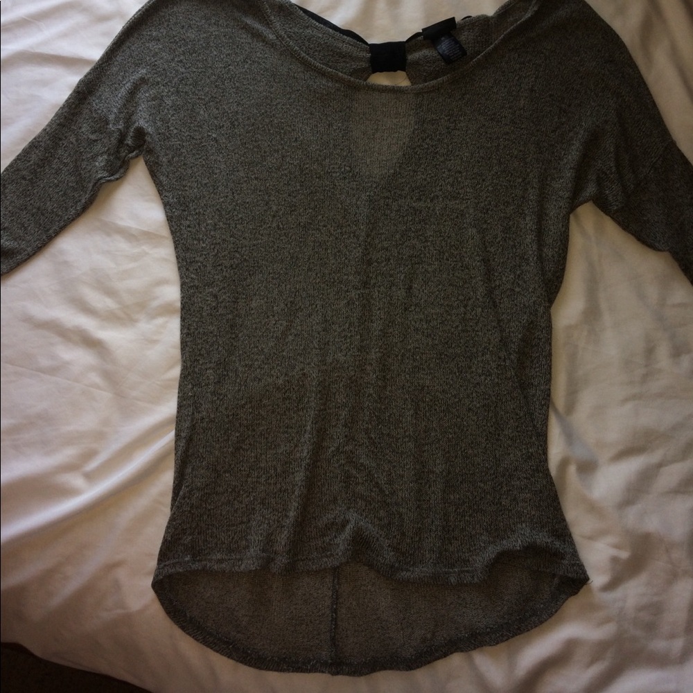 A grey top with a keyhole and bow on the back.