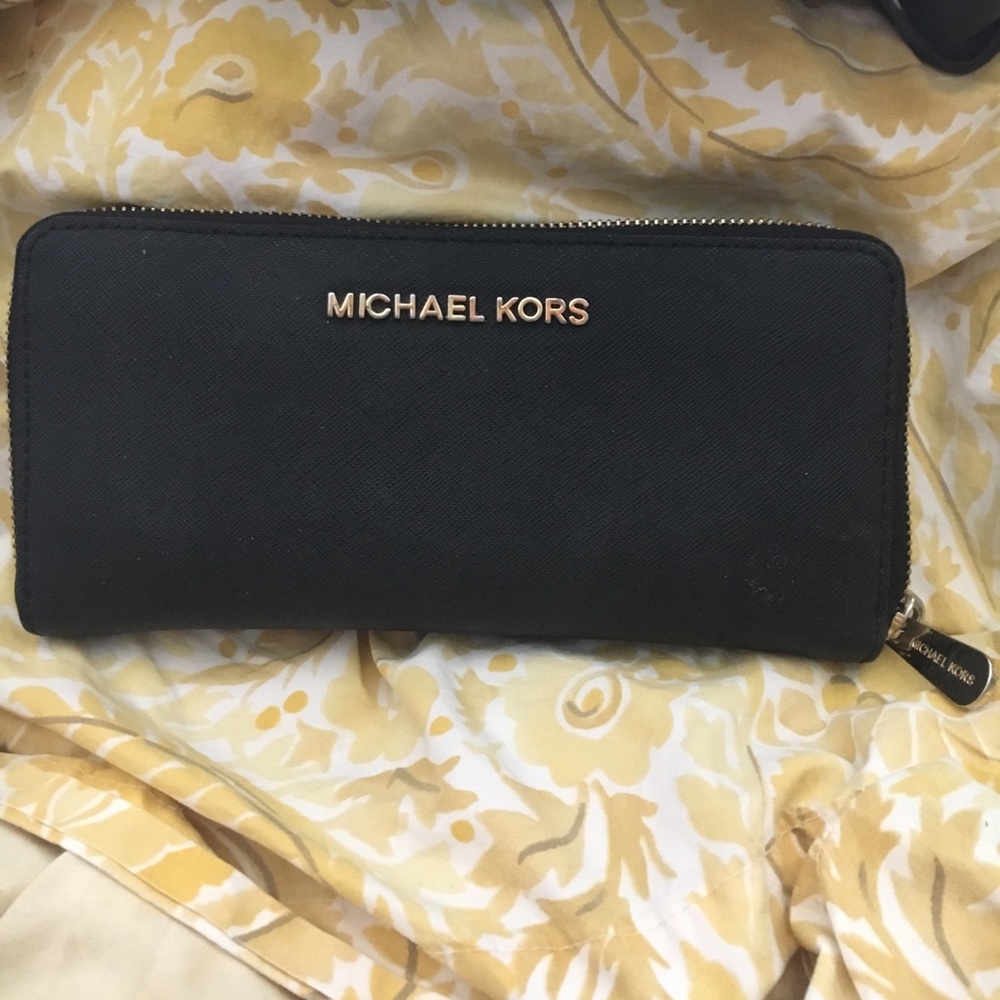 Matching black wallet with gold accents.