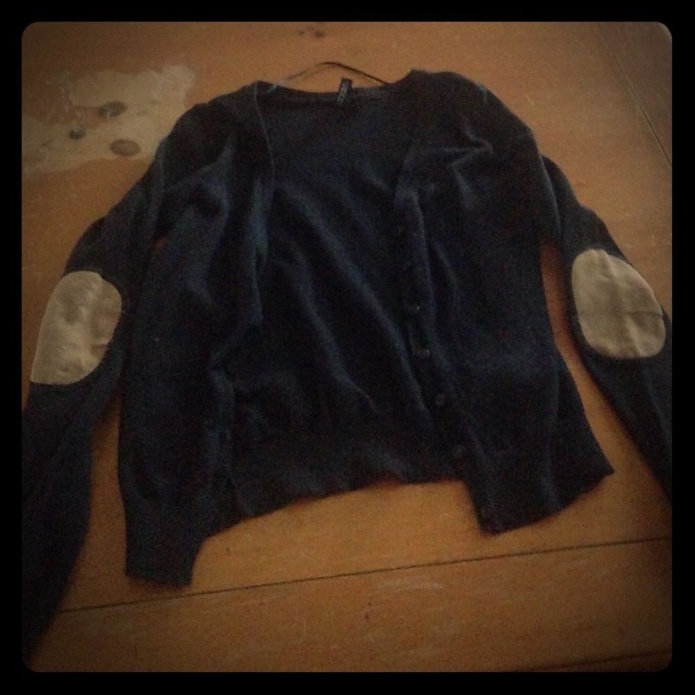 Black cardigan with black buttons and suede elbows