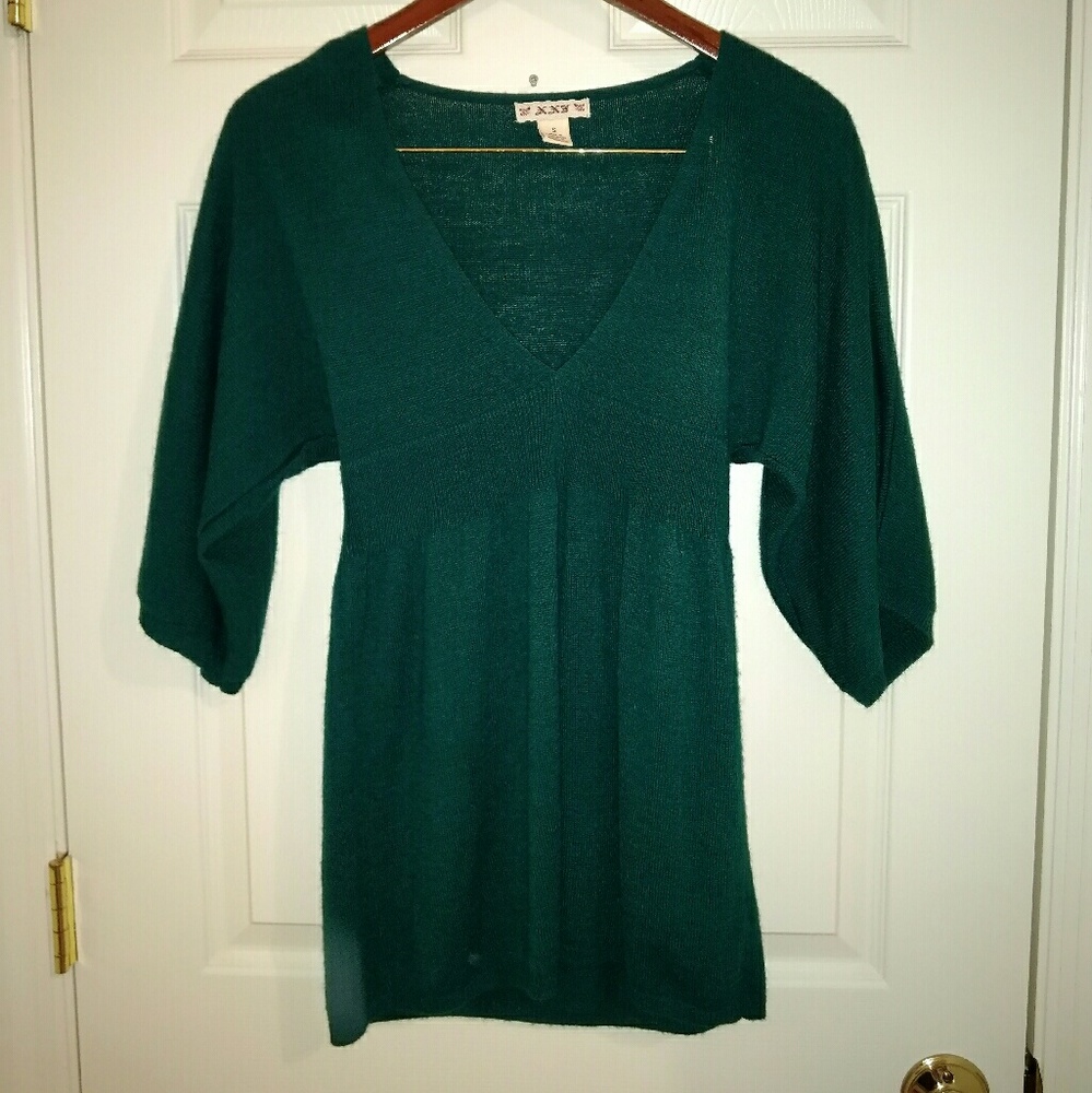 Green sweater top.