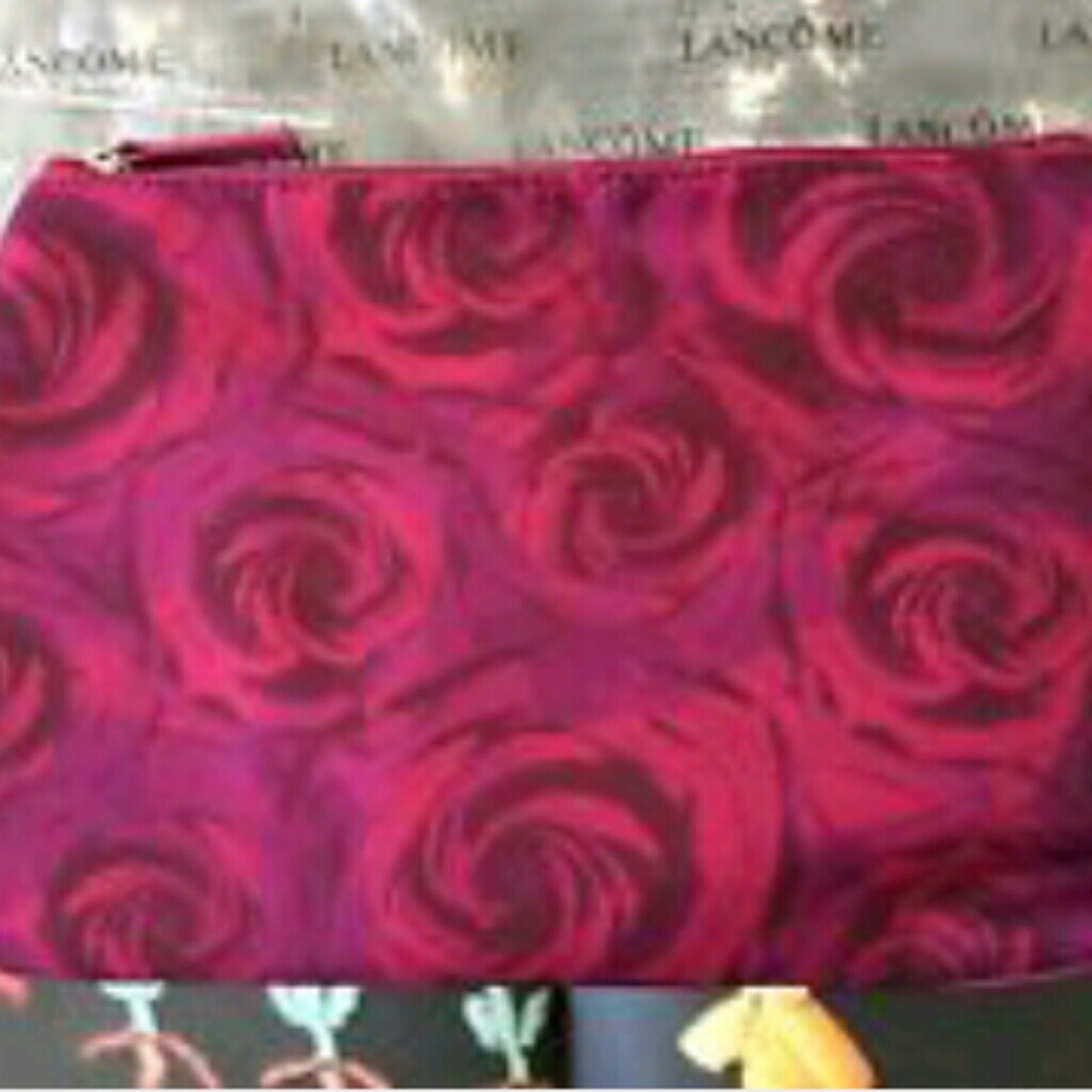 Free with any purchase. New Lancome bag.
