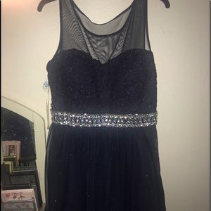 Dark blue knee length dress.