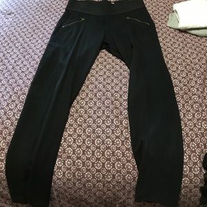 Black leggings with side gold zippers. High waist.