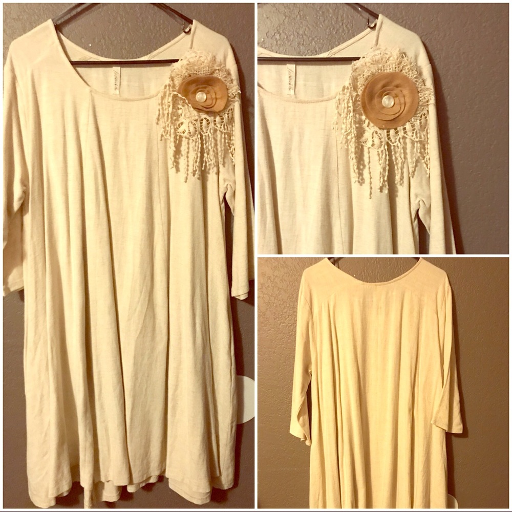 Beige Knee length dress with flower accessory