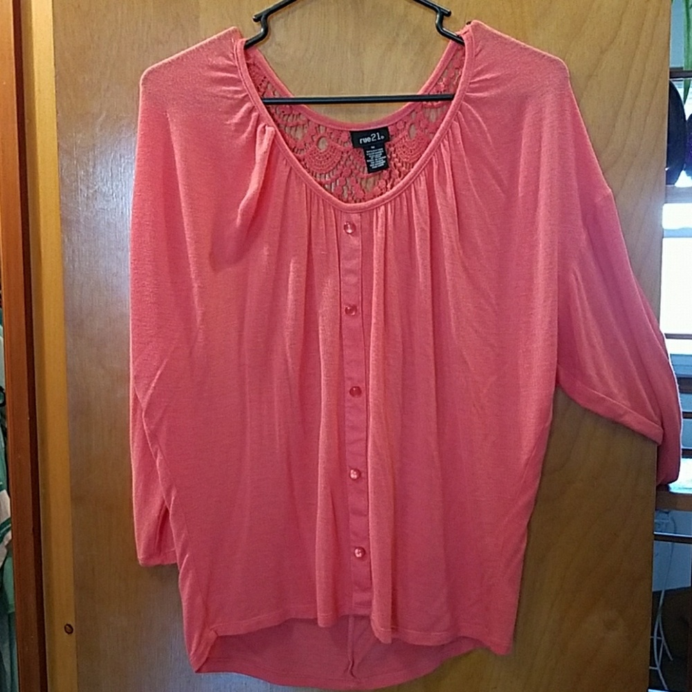 Coral colored 3/4 sleeve blouse.
