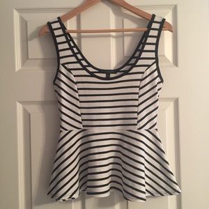 Black and white striped peplum sleeveless top