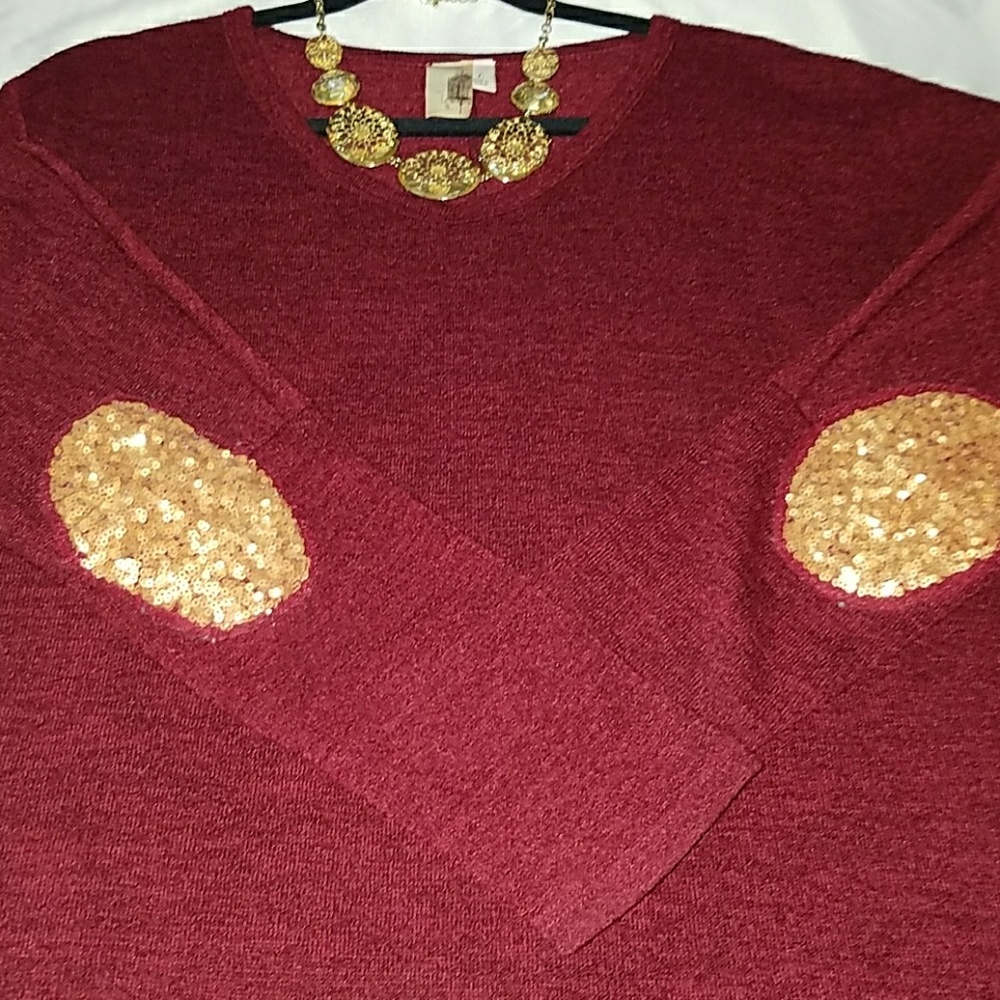 Long burgundy sweater with gold elbow patches