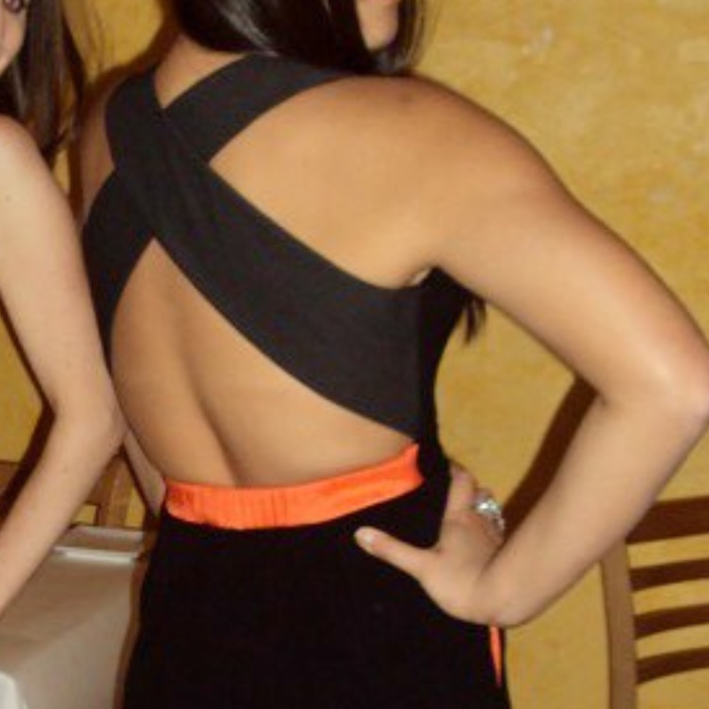 Black cocktail dress with orange detail