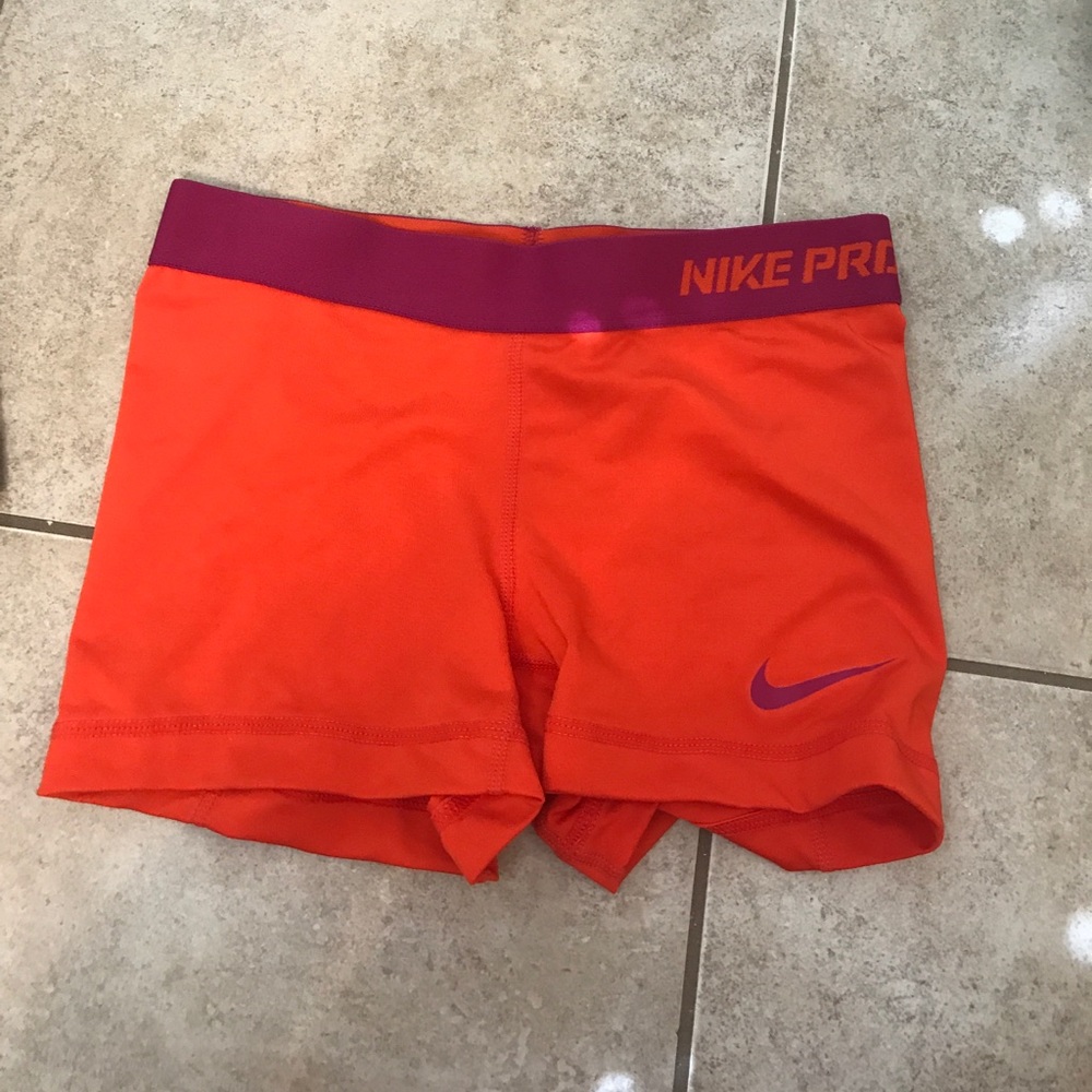 Orange & magenta Nike pros