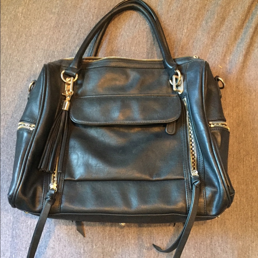 Black faux leather bag with tassels and gold