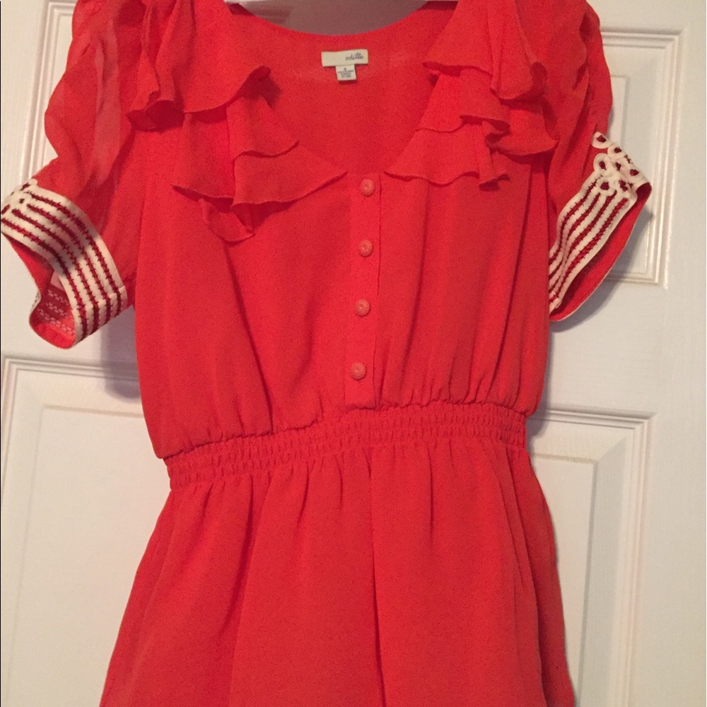 Coral, peplum blouse, with 40s-esque style.