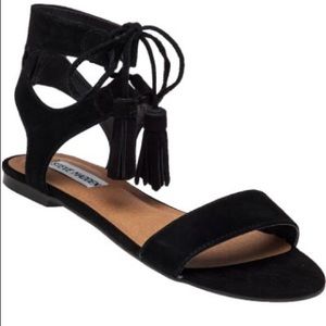 Black gladiator tassel sandals