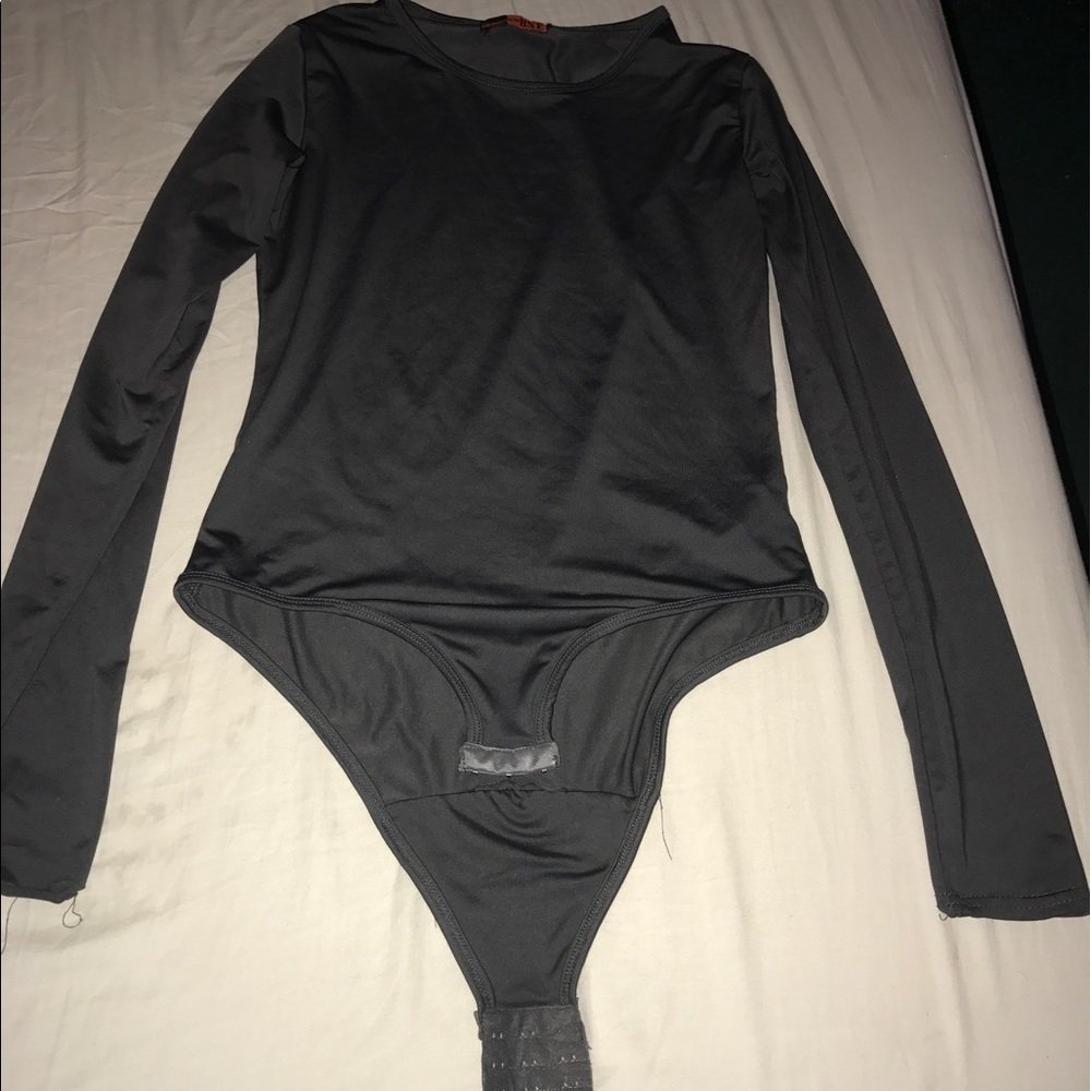 A gray long sleeve one piece