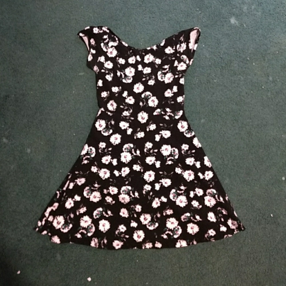 A short floral dress cut out in the back