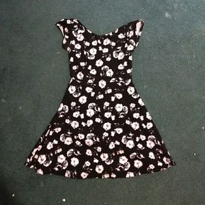 A short floral dress cut out in the back