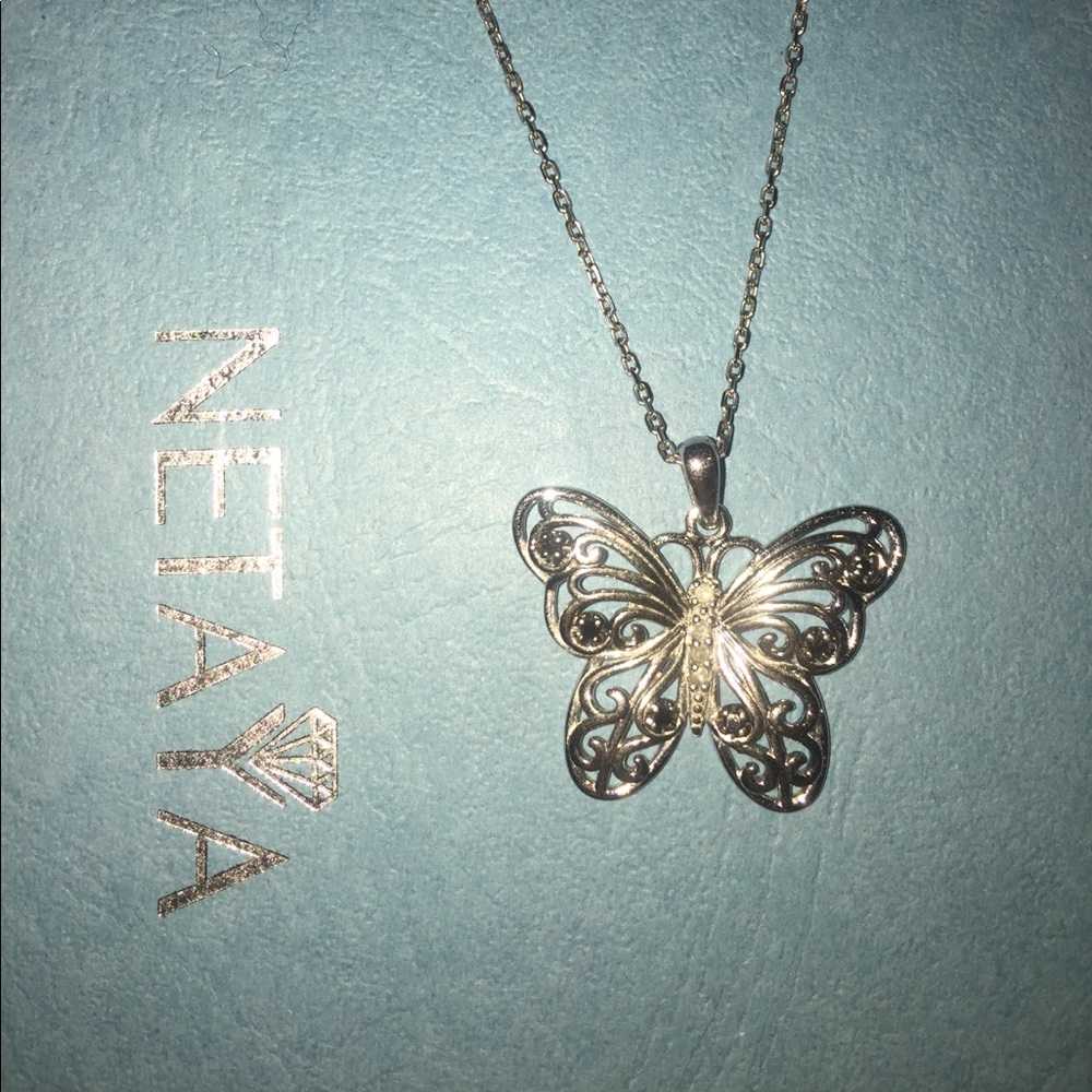 Price negotiable. Butterfly necklace/black stones.