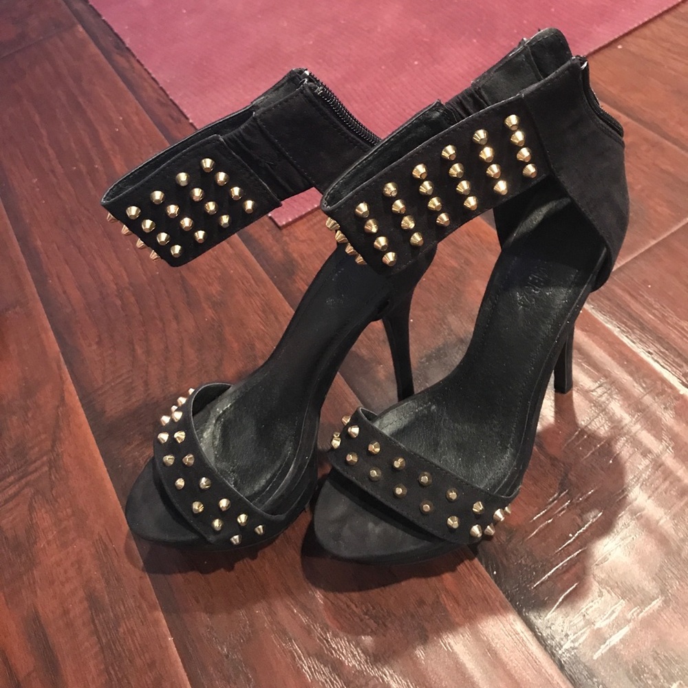 Black high heels with gold studs