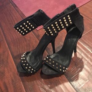 Black high heels with gold studs