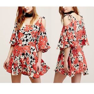 Free People red floral dress with tie sleeves.