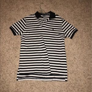 Black/white striped polo shirt.