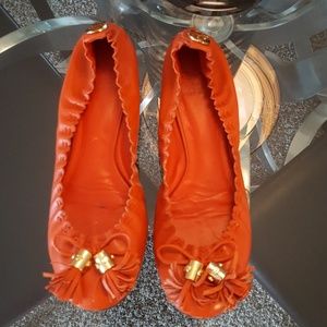 Tory Burch orange tassel flats