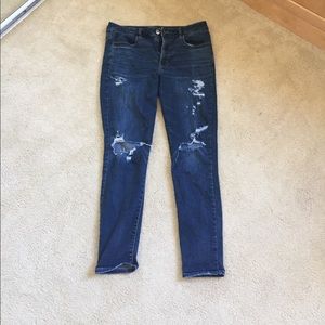 Selling women's distressed dark wash jeans